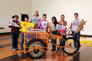 Dylan Miner with some of the youth who worked on the mobile screen printing bicycle.