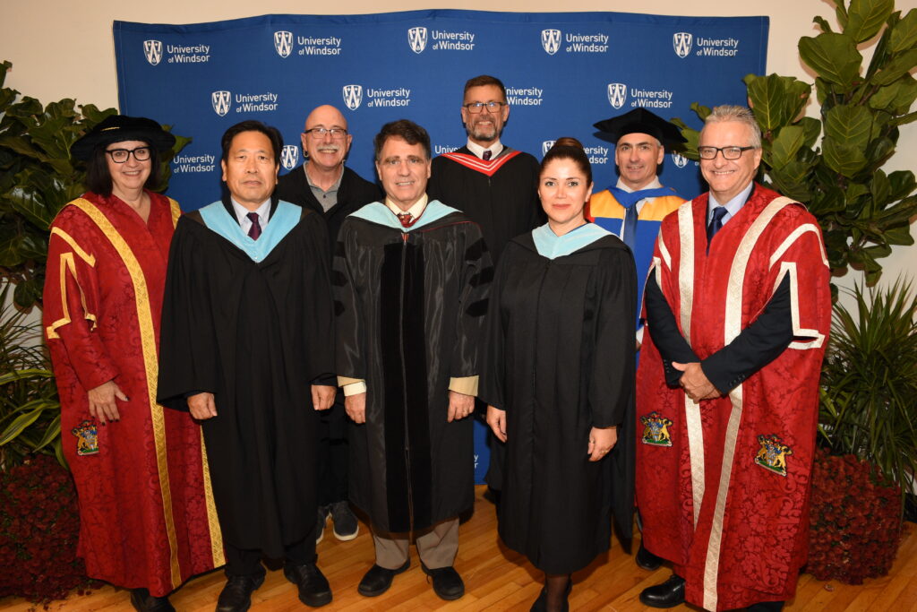 Dr Smith with education colleagues at convocation