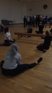 Students engage in a game of seated volleyball.